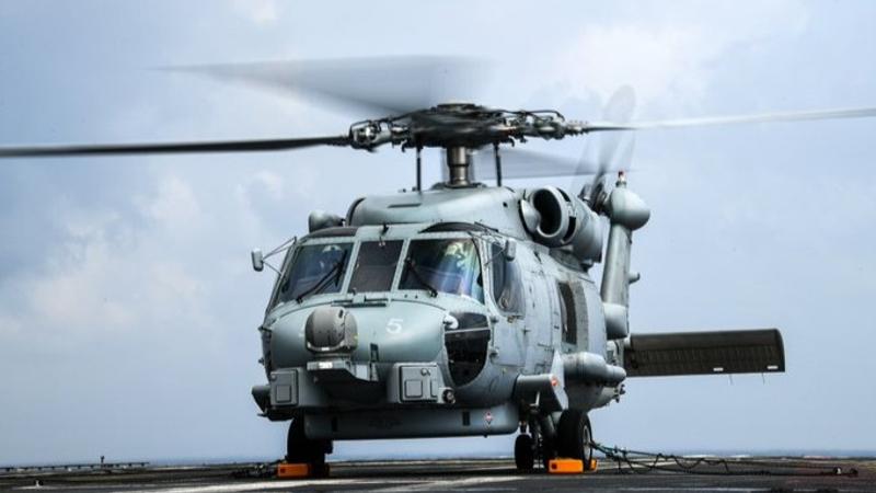 An Indian Navy MH-60R Seahawk helicopter on INS Vikrant's deck.