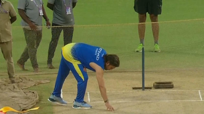 MS Dhoni inspecting the pitch