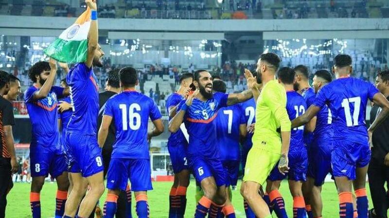 Indian footballers celebrating after a match