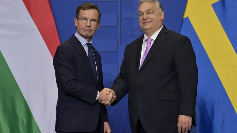 Sweden’s Prime Minister Ulf Kristersson (left) shakes hands with his Hungarian counterpart Viktor Orban in Budapest.