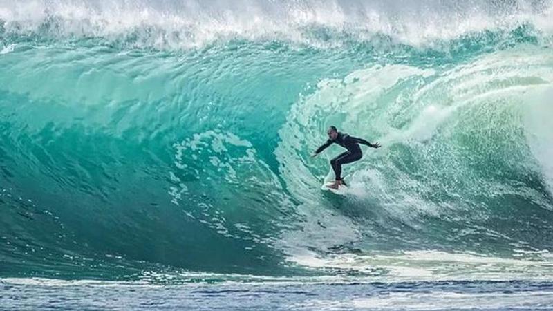 Drone video shows Australian surfer's close call with shark