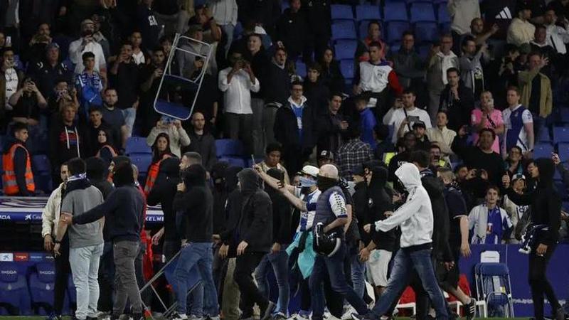 Early end to Barcelona's title celebrations after Espanyol fans invade pitch