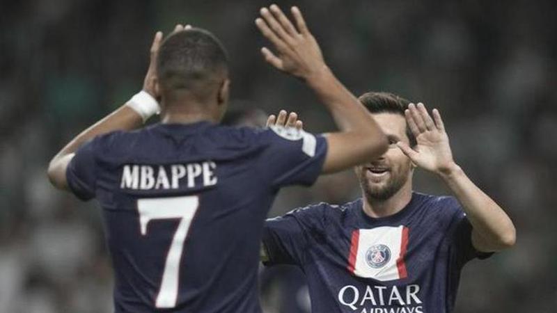 Kylian Mbappe celebrating with Lionel Messi