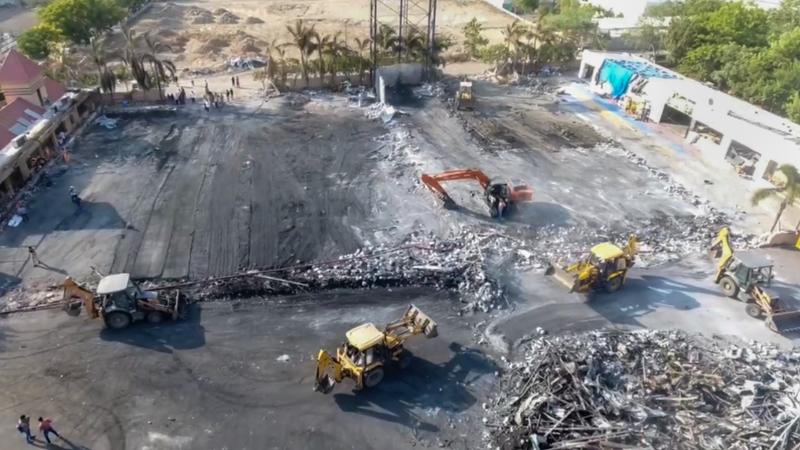  Debris being removed from the game zone site where a fire broke out in Rajkot.