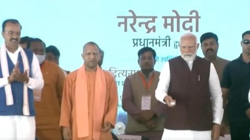 Prime Minister Narendra Modi with Uttar Pradesh Chief Minister Yogi Adityanath during the foundation stone laying and inauguration ceremony of various developmental projects, in Azamgarh