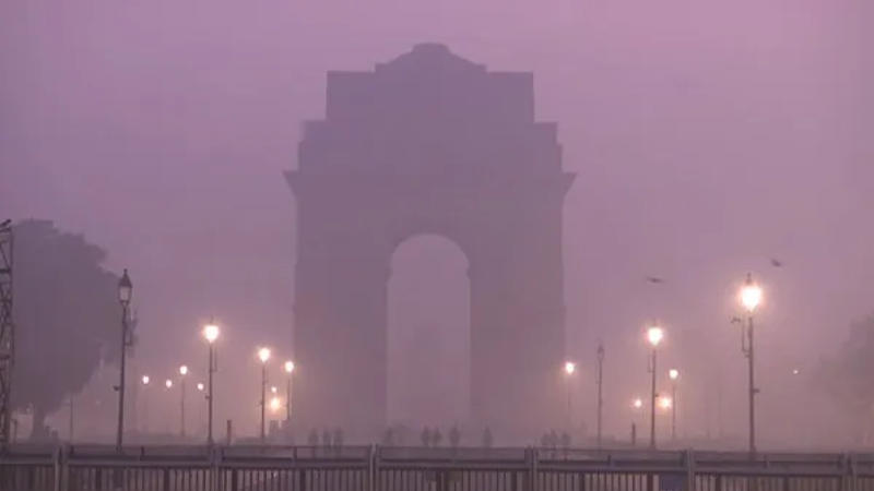 India Gate shrouded with fog. 