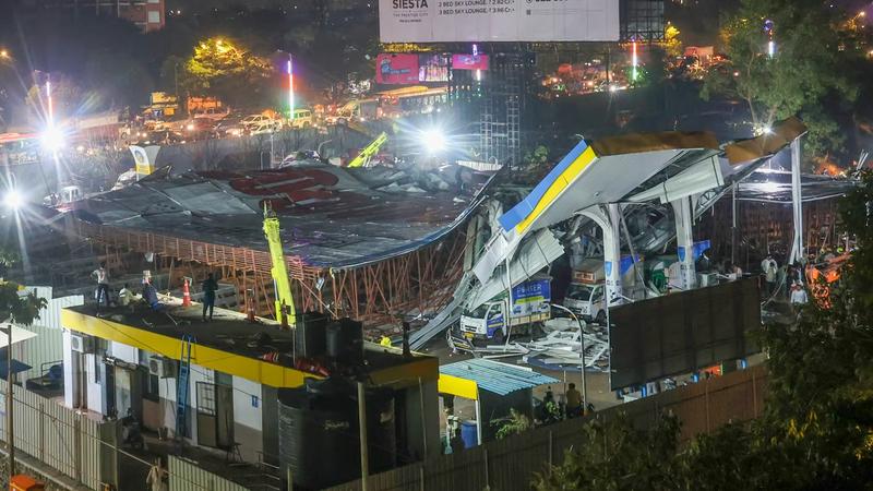 A damaged petrol pump after a huge iron hoarding collapsed on it due to strong winds and heavy rain, at Ghatkopar in Mumbai, Monday