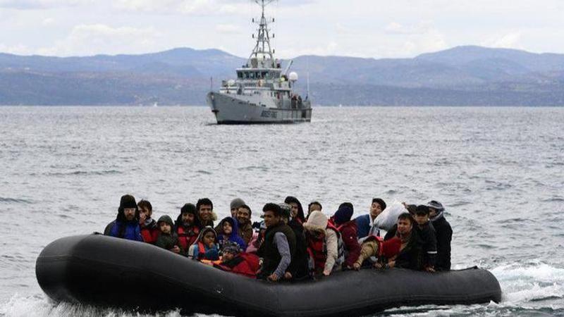 Greek coast guard tries to stop migrant boat