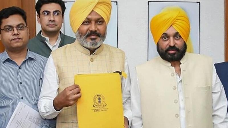 Punjab finance minister Harpal Singh Cheema with chief minister Bhagwant Mann 