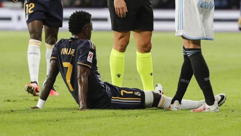 Real Madrid’s Vinicius Junior sits on the pitch after being injured during the Spanish La Liga