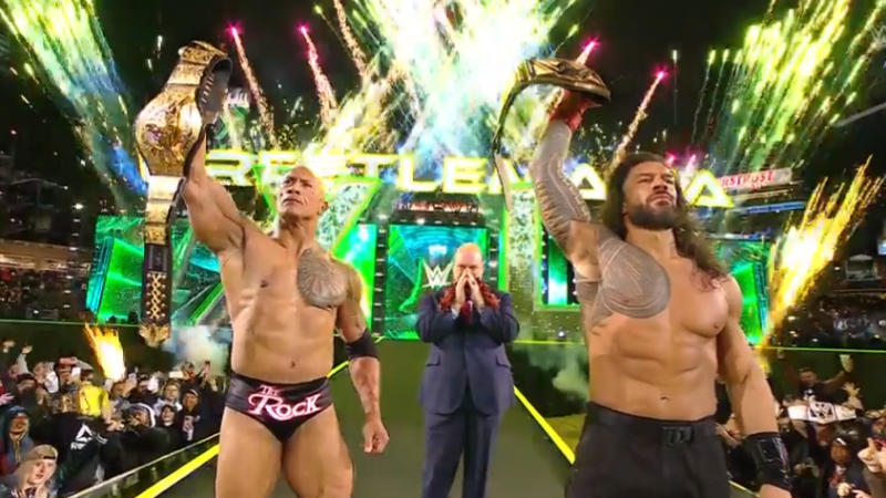 The Rock and Roman Reigns after defeating Cody Rhodes and Seth Rollins