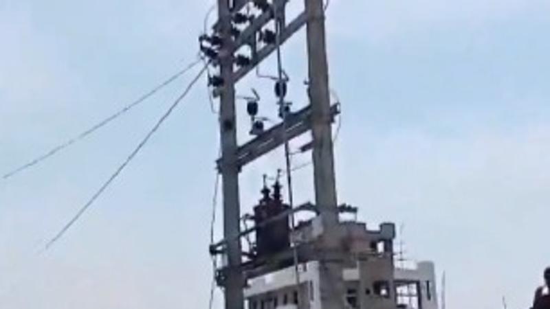 Video: Woman Climbs Electric Pole After Hubby Discovers Her Affair