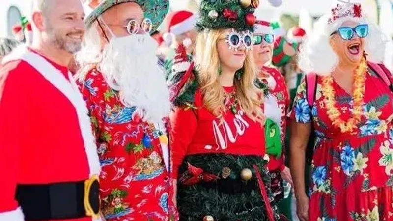 Surfing Santas hit the waves for Florida Space Coast tradition.