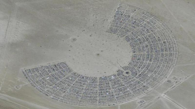 Nevada desert: Burning Man revelers begin exodus after flooding left tens of thousands stranded