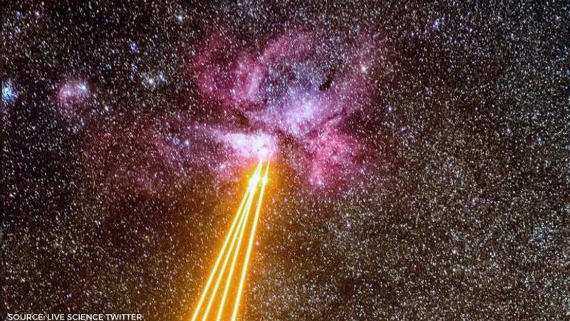 Earth and Carina Nebula Laser Duel