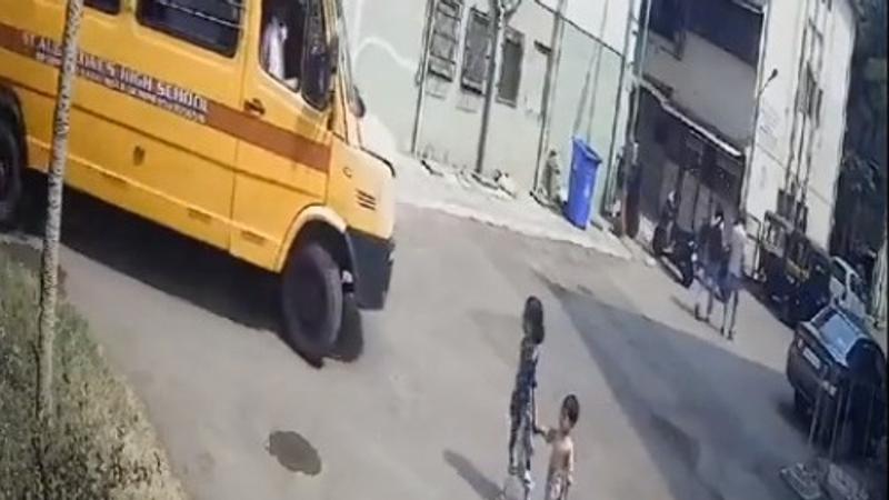 Siblings injured after school bus runs over them