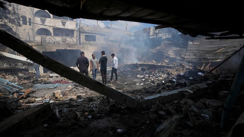 Palestinians look at the destruction after an Israeli strike on a school run by UNRWA, the U.N. agency helping Palestinian refugees, in Nuseirat, Gaza Strip, May 14, 2024. 
