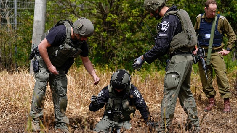 FILE - Israeli security forces examine the site hit by a rocket fired from Lebanon, in Kiryat Shmona, northern Israel, March 27, 2024.