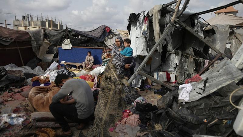 Displaced Palestinians inspect their tents destroyed by Israel's bombardment, adjunct to an UNRWA facility west of Rafah city, Gaza Strip, May 28, 2024. 