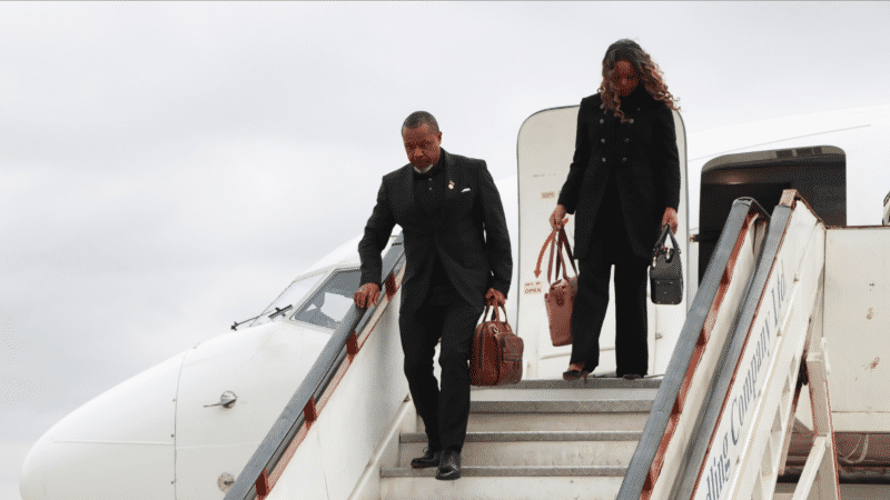 Malawi Vice President Saulos Chilima,left, and his wife Mary disembark from a plane upon his return from South Korea in Lillongwe, June 9, 2024. 